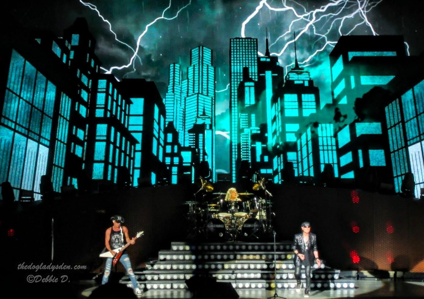 Scorpions in concert with aquamarine background